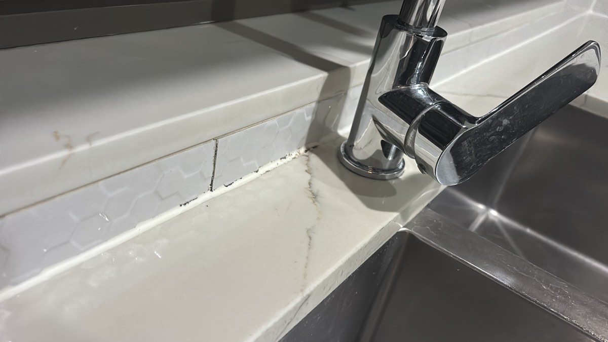 Mouldy sealant on an older wet area, Craigieburn